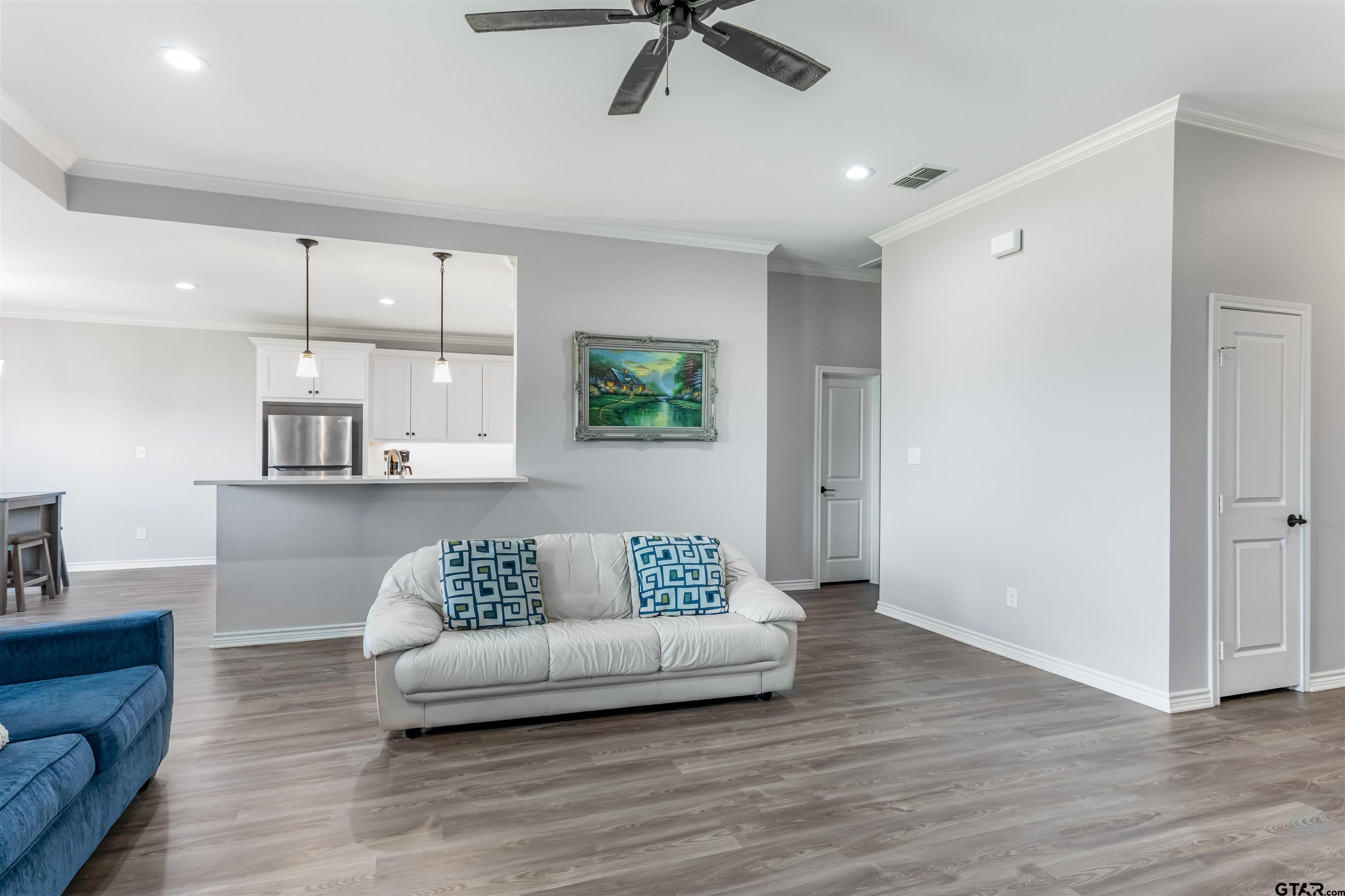 12908 County Road 46 Tyler, TX 75704 - Photo 11 of 24 a living room with furniture and a dining table
