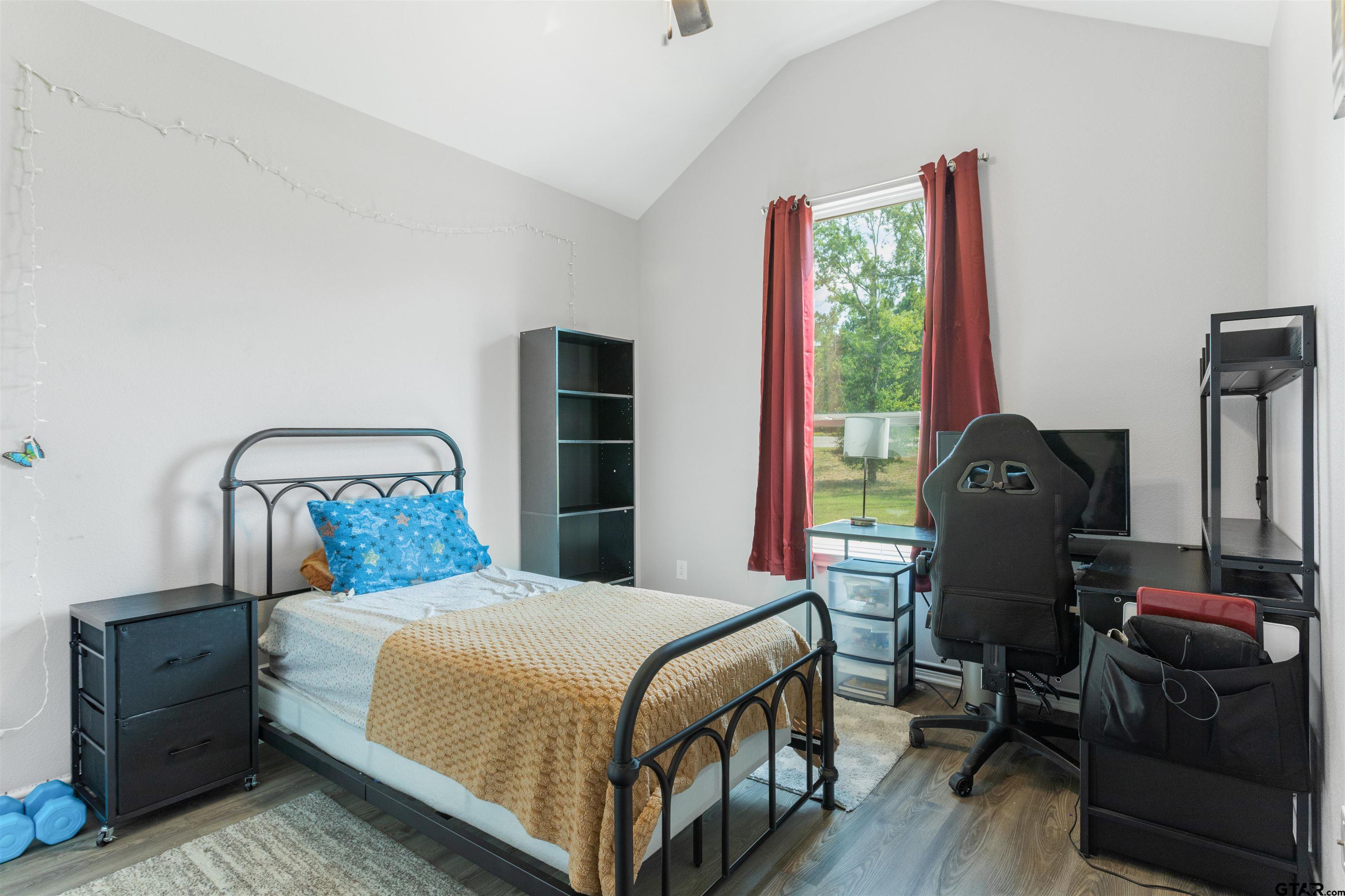 12908 County Road 46 Tyler, TX 75704 - Photo 21 of 24 a bedroom with a bed a window and dresser