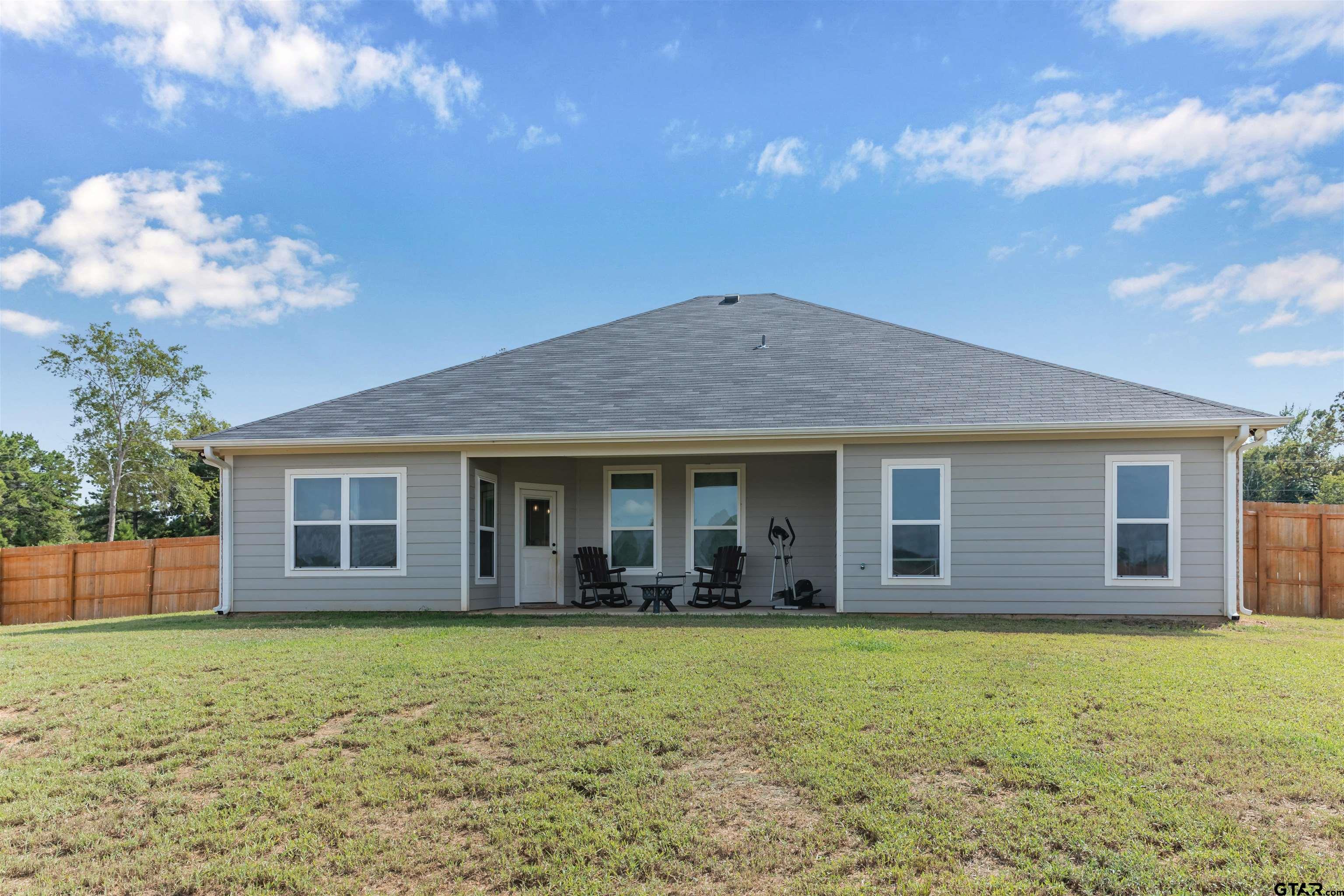 12908 County Road 46 Tyler, TX 75704 - Photo 4 of 24 a house view with a garden space