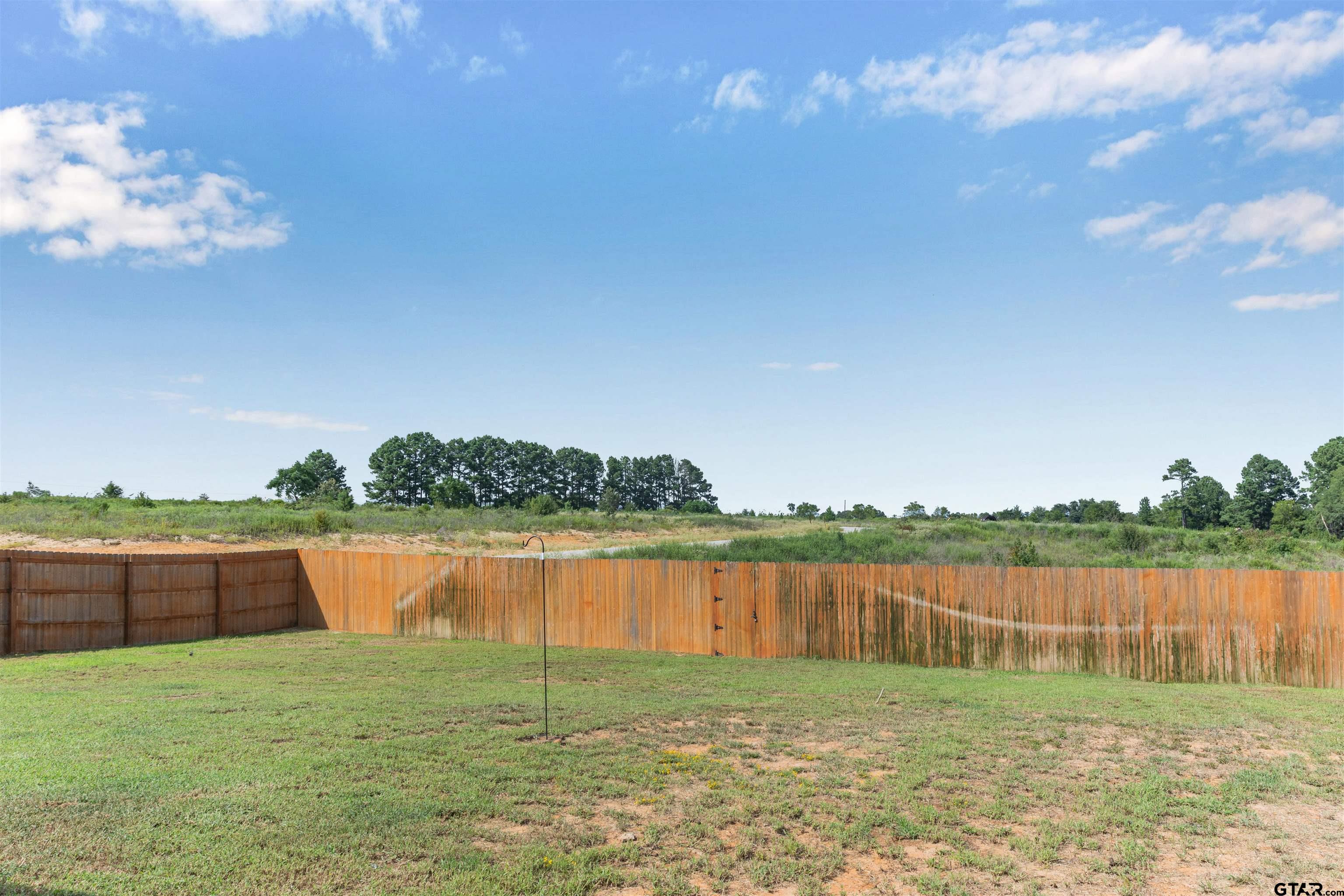 12908 County Road 46 Tyler, TX 75704 - Photo 5 of 24 a view of a lake with houses in the back