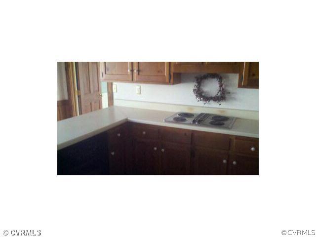 13801 Sterlings Bridge Road Midlothian, VA 23112 - Photo 3 of 5 a kitchen with a sink a stove and lots of wooden floor