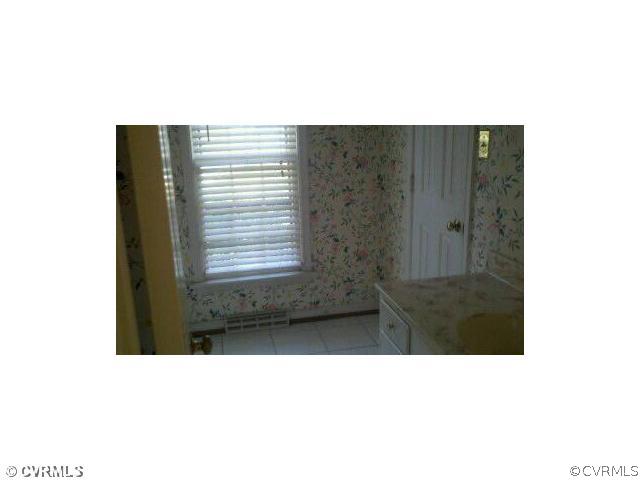 13801 Sterlings Bridge Road Midlothian, VA 23112 - Photo 4 of 5 a bathroom with a sink and a mirror
