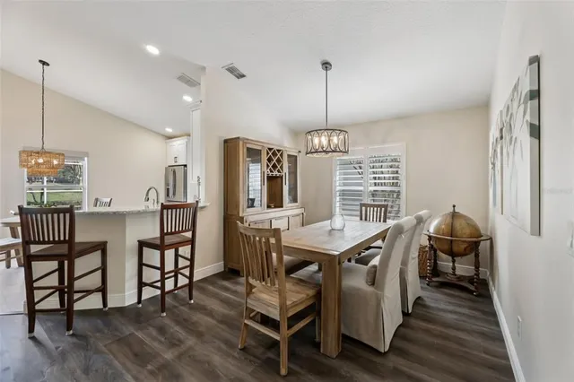 a spacious bathroom with a granite countertop tub double and mirror