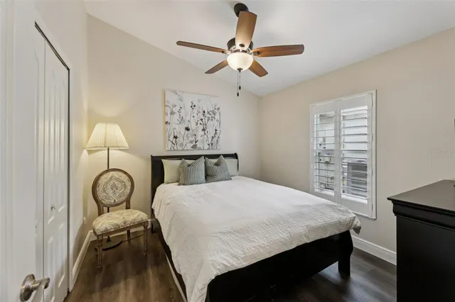 a view of a house with a yard and potted plants