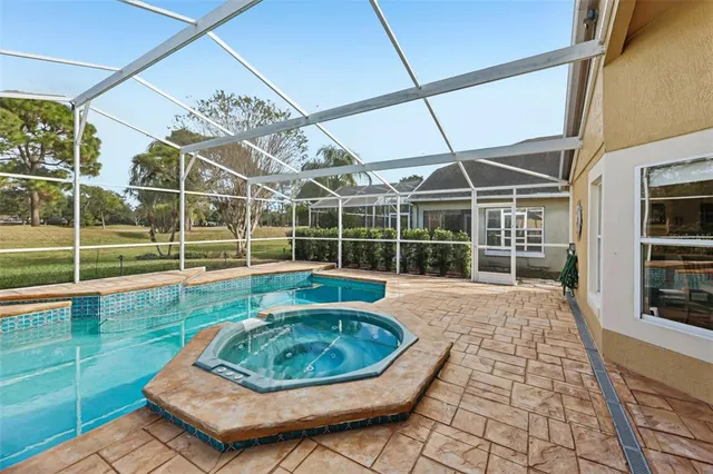 a view of a lake with houses in the back