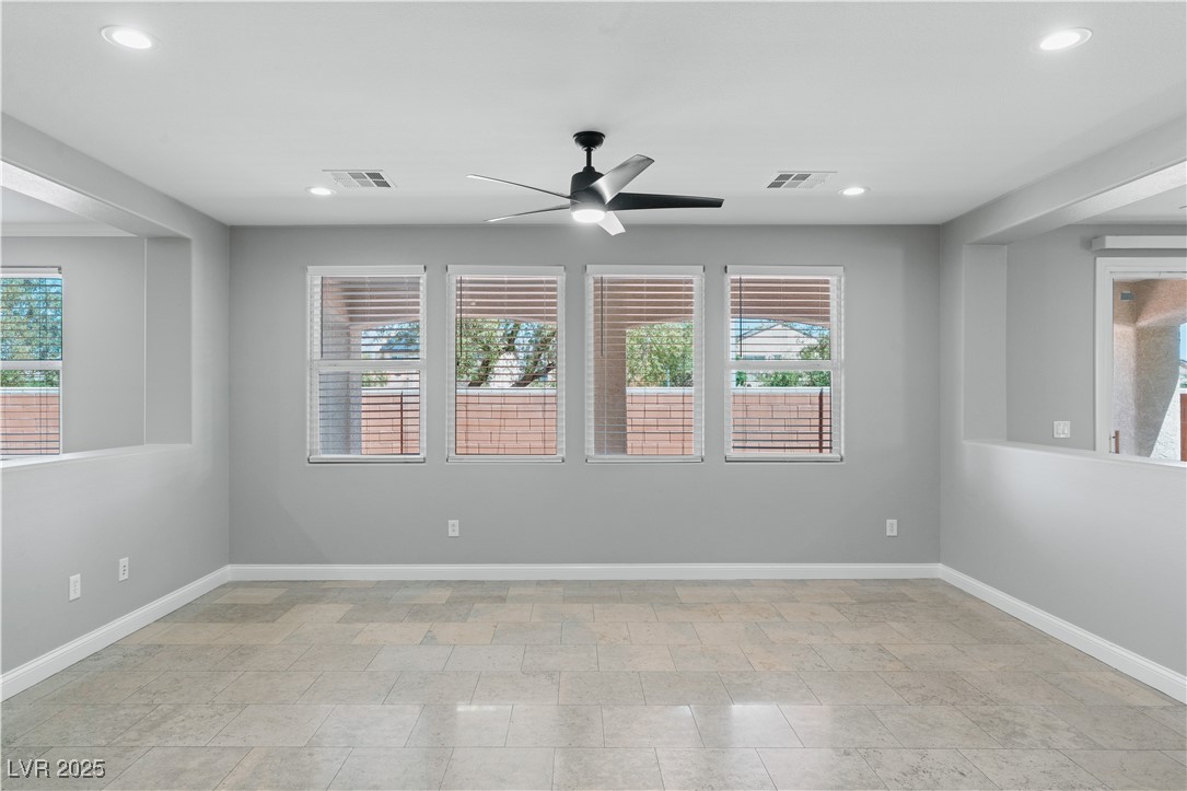 312 Pocono Ranch Avenue North Las Vegas, NV 89031 - Photo 12 of 34 Empty room with a ceiling fan, visible vents, and baseboards