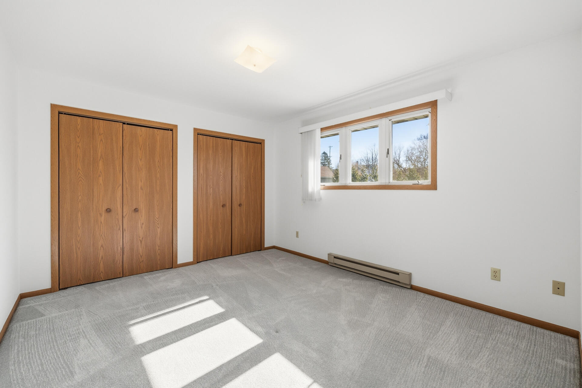 160 Maple Avenue South, Unit 6 Slinger, WI 53086 - Photo 11 of 17 Bedroom 2