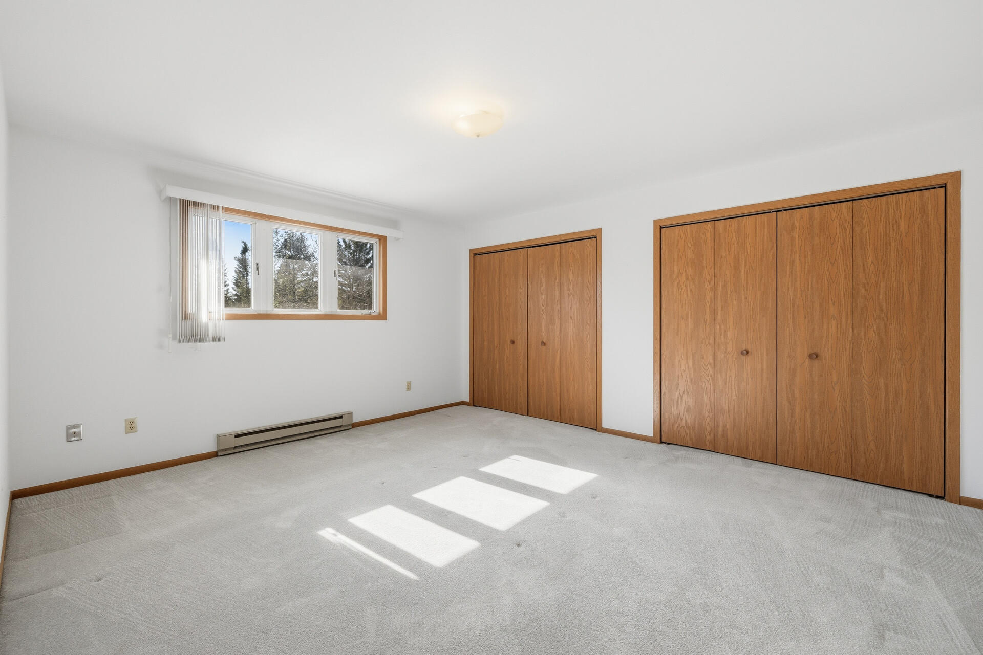 160 Maple Avenue South, Unit 6 Slinger, WI 53086 - Photo 9 of 17 Primary Bedroom