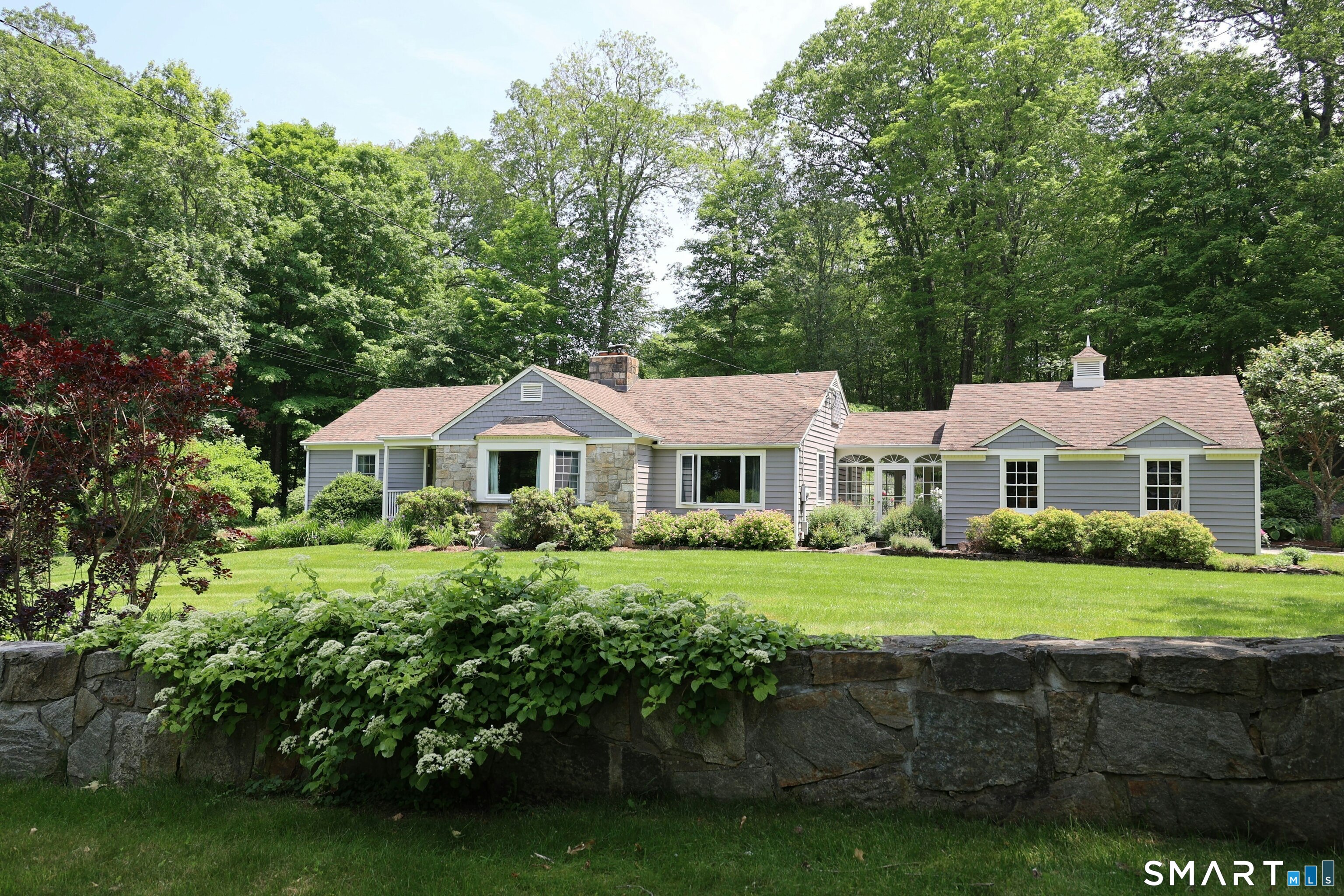 172 Gallows Hill Road Redding, CT 06896 - Photo 1 of 40 a front view of a house with a yard
