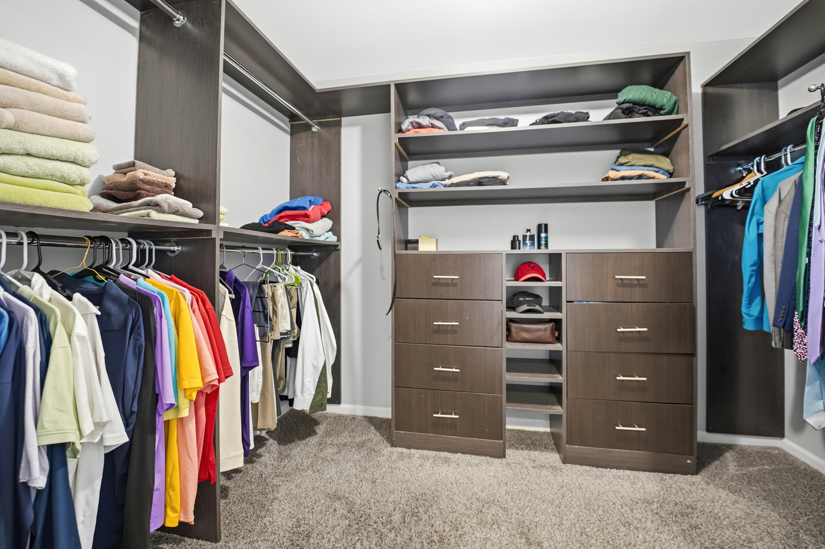 136 Lilac Street Bolingbrook, IL 60490 - Photo 13 of 30 a view of walk in closet with clothes and shoes