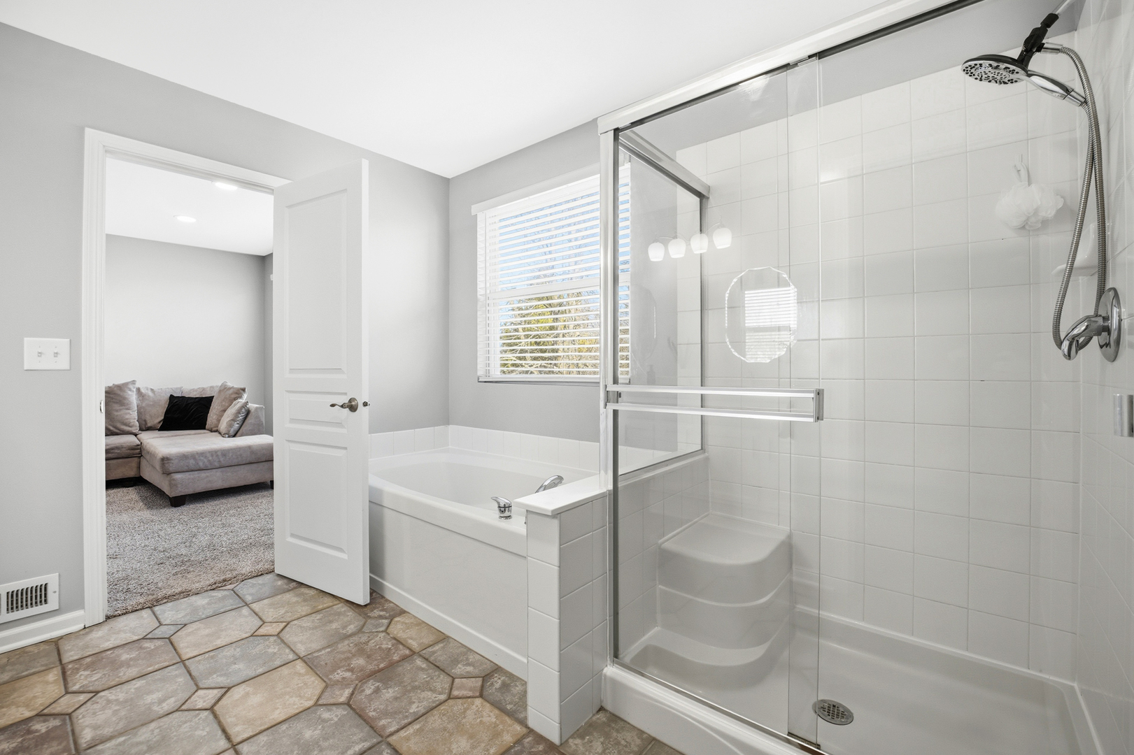 136 Lilac Street Bolingbrook, IL 60490 - Photo 15 of 30 a spacious bathroom with a shower and a sink