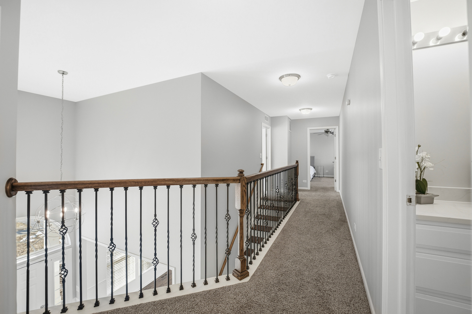 136 Lilac Street Bolingbrook, IL 60490 - Photo 20 of 30 a view of a hallway with wooden floor and staircase