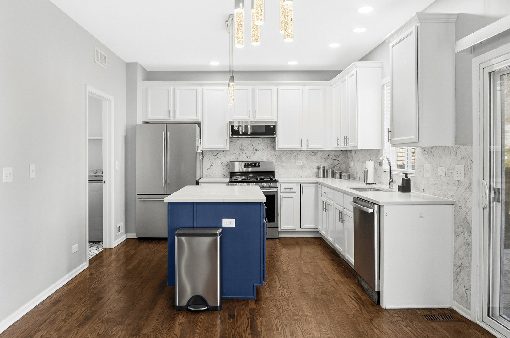 136 Lilac Street Bolingbrook, IL 60490 - Photo 2 of 30 a kitchen with wooden cabinets and stainless steel appliances