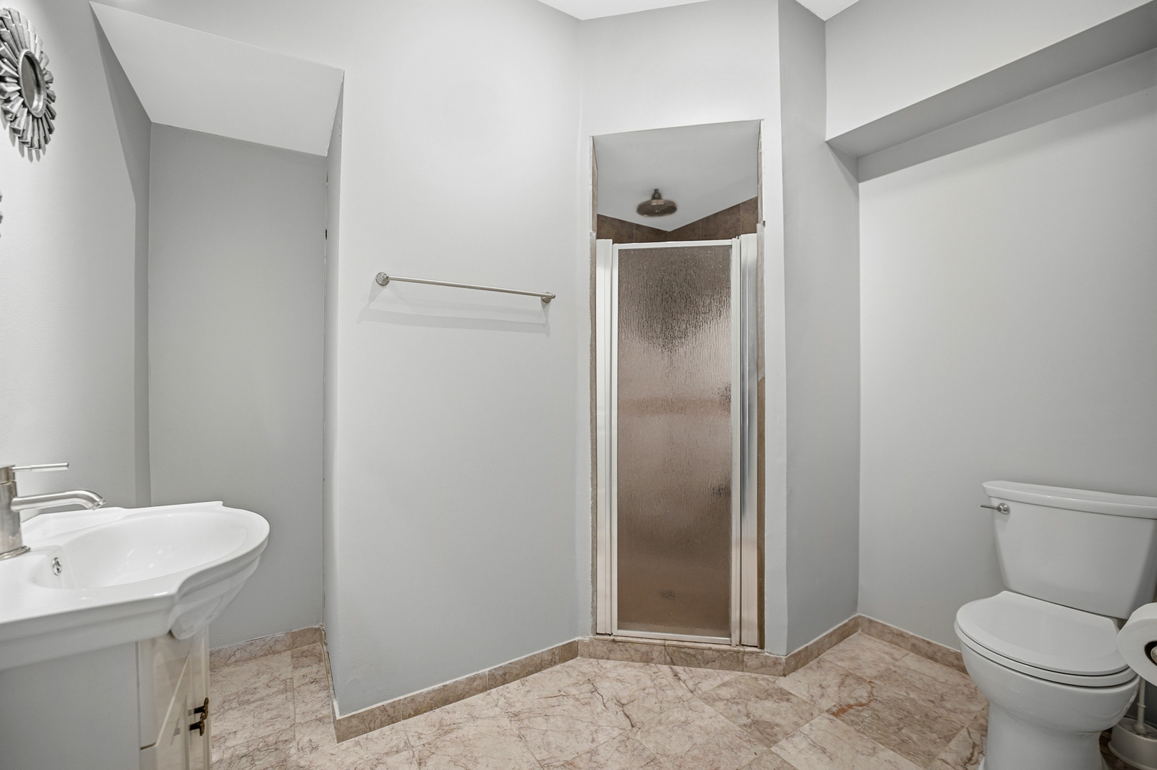 136 Lilac Street Bolingbrook, IL 60490 - Photo 25 of 30 a bathroom with a toilet sink and shower