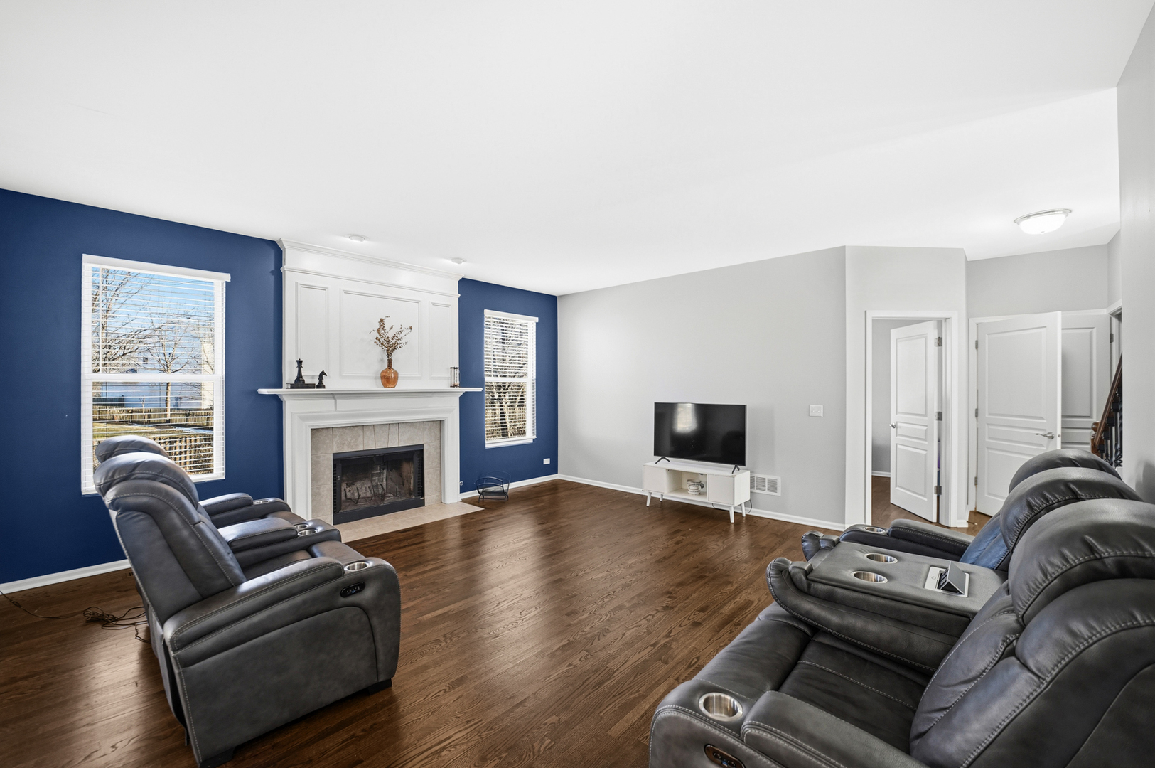 136 Lilac Street Bolingbrook, IL 60490 - Photo 5 of 30 a living room with furniture a fireplace and a flat screen tv