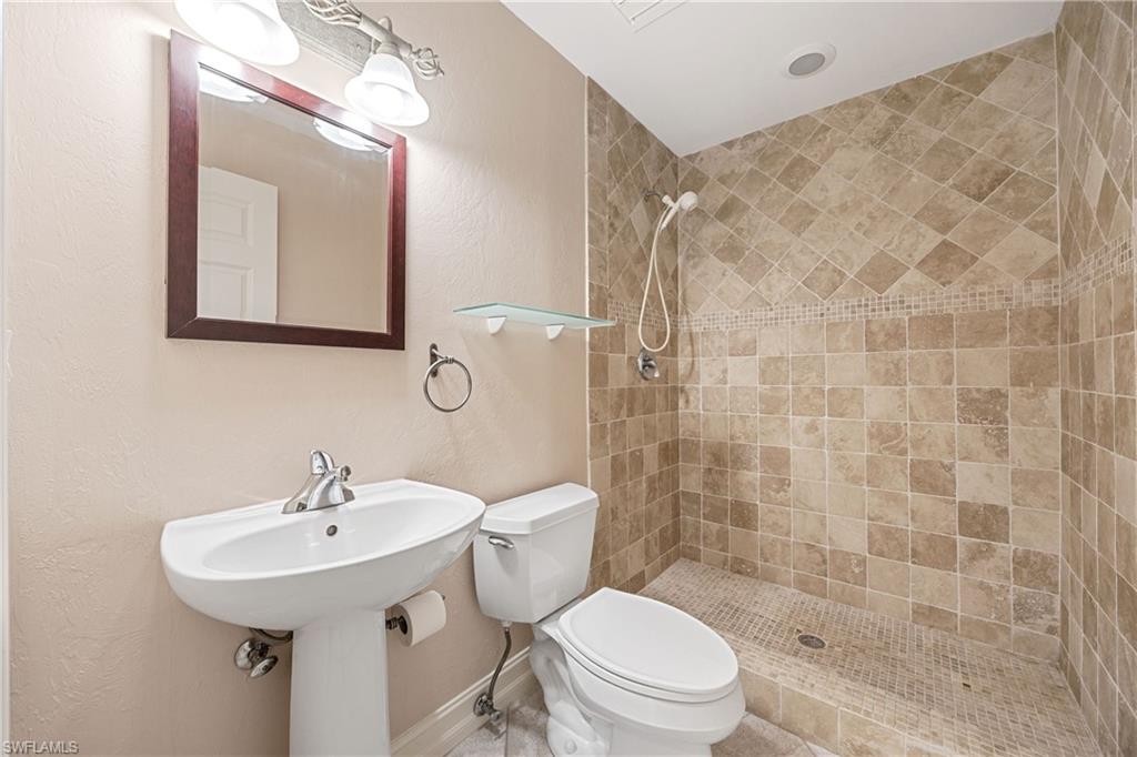 1120 Ridge Street Naples, FL 34103 - Photo 14 of 39 Upgraded, large, full, guest Bathroom with tiled shower, modern fixtures.