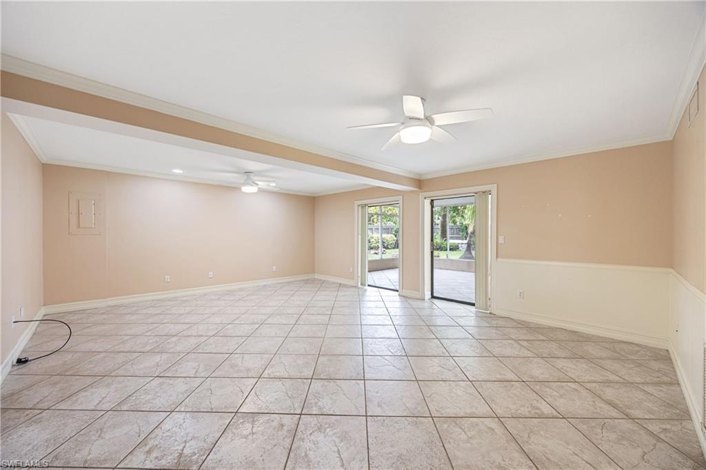 1120 Ridge Street Naples, FL 34103 - Photo 21 of 39 Large , open Living Room/Great Room featuring volume ceiling, crown moulding, tile floors, modern ceiling fans with lights. Lots of natural light.
