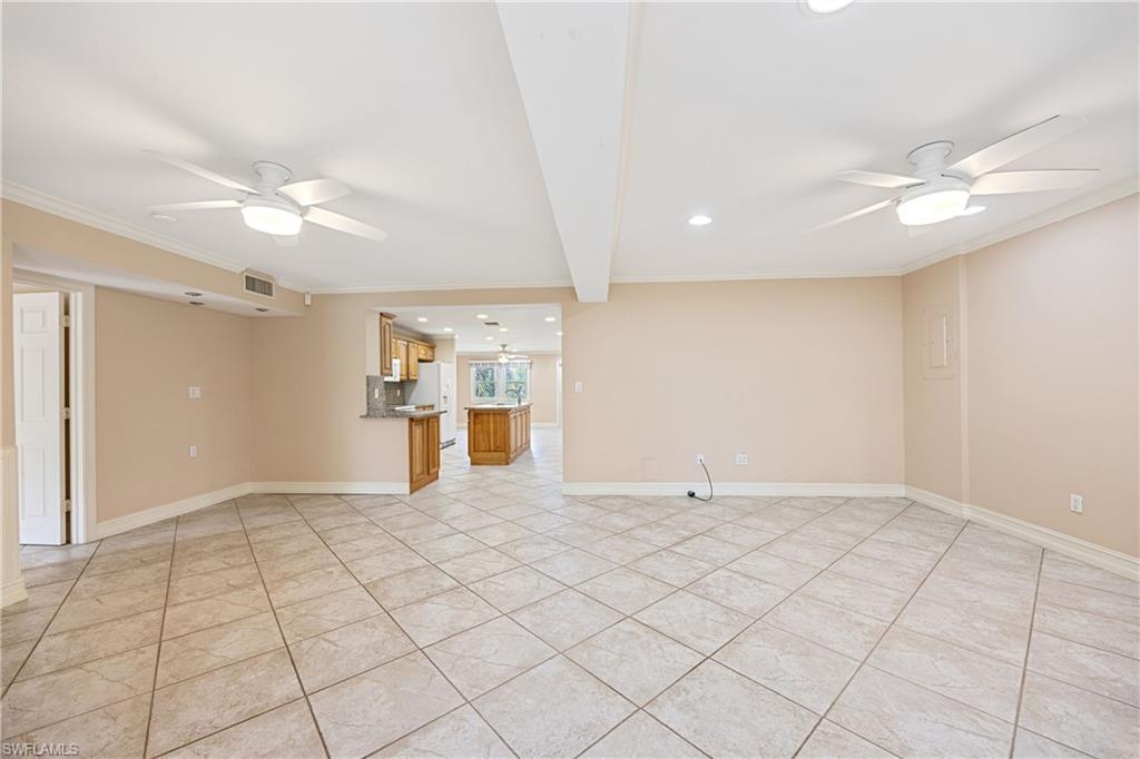 1120 Ridge Street Naples, FL 34103 - Photo 25 of 39 Living room / Great Room featuring modern ceiling fan, light tile patterned floors, ornamental molding, recessed lighting, and volume ceiling