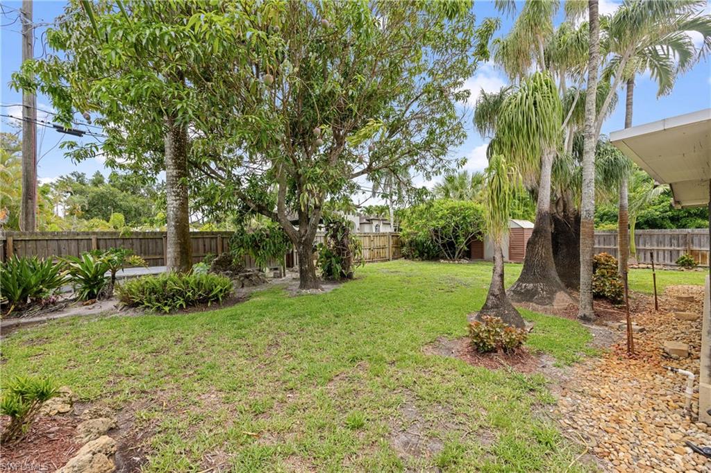 1120 Ridge Street Naples, FL 34103 - Photo 36 of 39 Fenced backyard includes a slide open back gate access for boat storage.