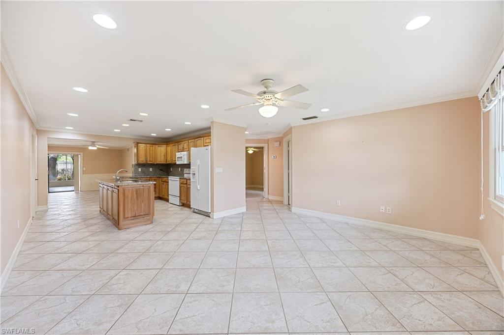 1120 Ridge Street Naples, FL 34103 - Photo 39 of 39 Kitchen featuring white appliances, ceiling fan, ornamental molding, open floor plan, and recessed lighting