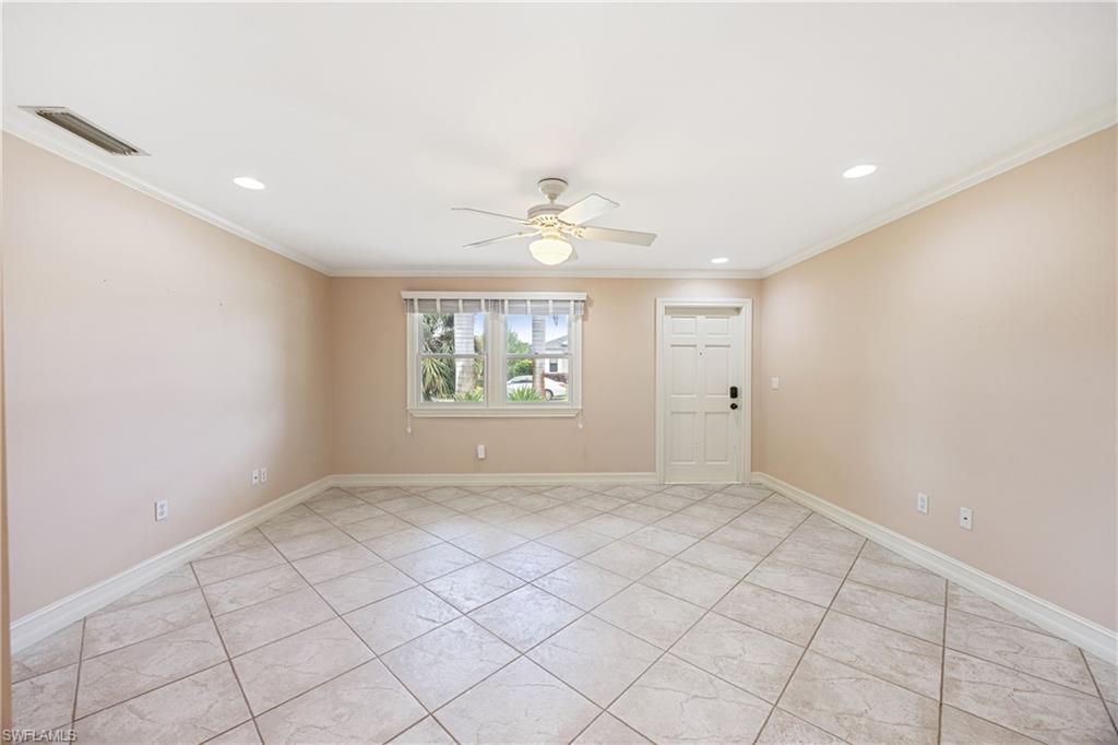 1120 Ridge Street Naples, FL 34103 - Photo 8 of 39 Expansive entry/Recessed lighting, light tile patterned floors, and crown molding