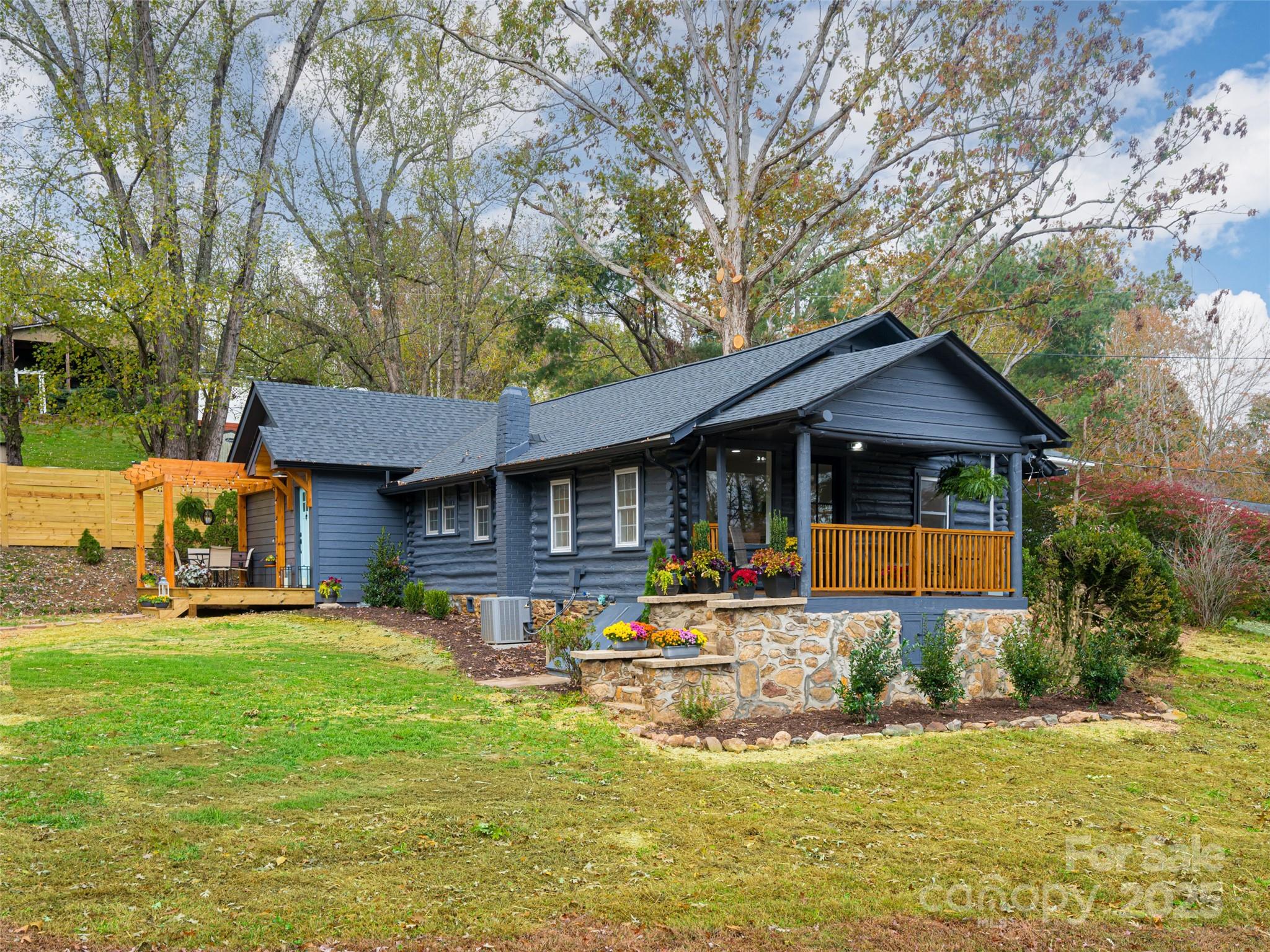 a front view of a house with a yard patio and fire pit