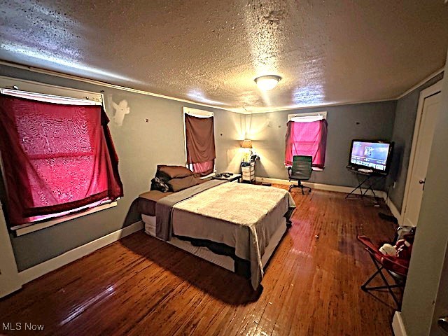 1209 Rice Avenue Lima, OH 45805 - Photo 6 of 14 Bedroom with a textured ceiling and hardwood / wood-style flooring