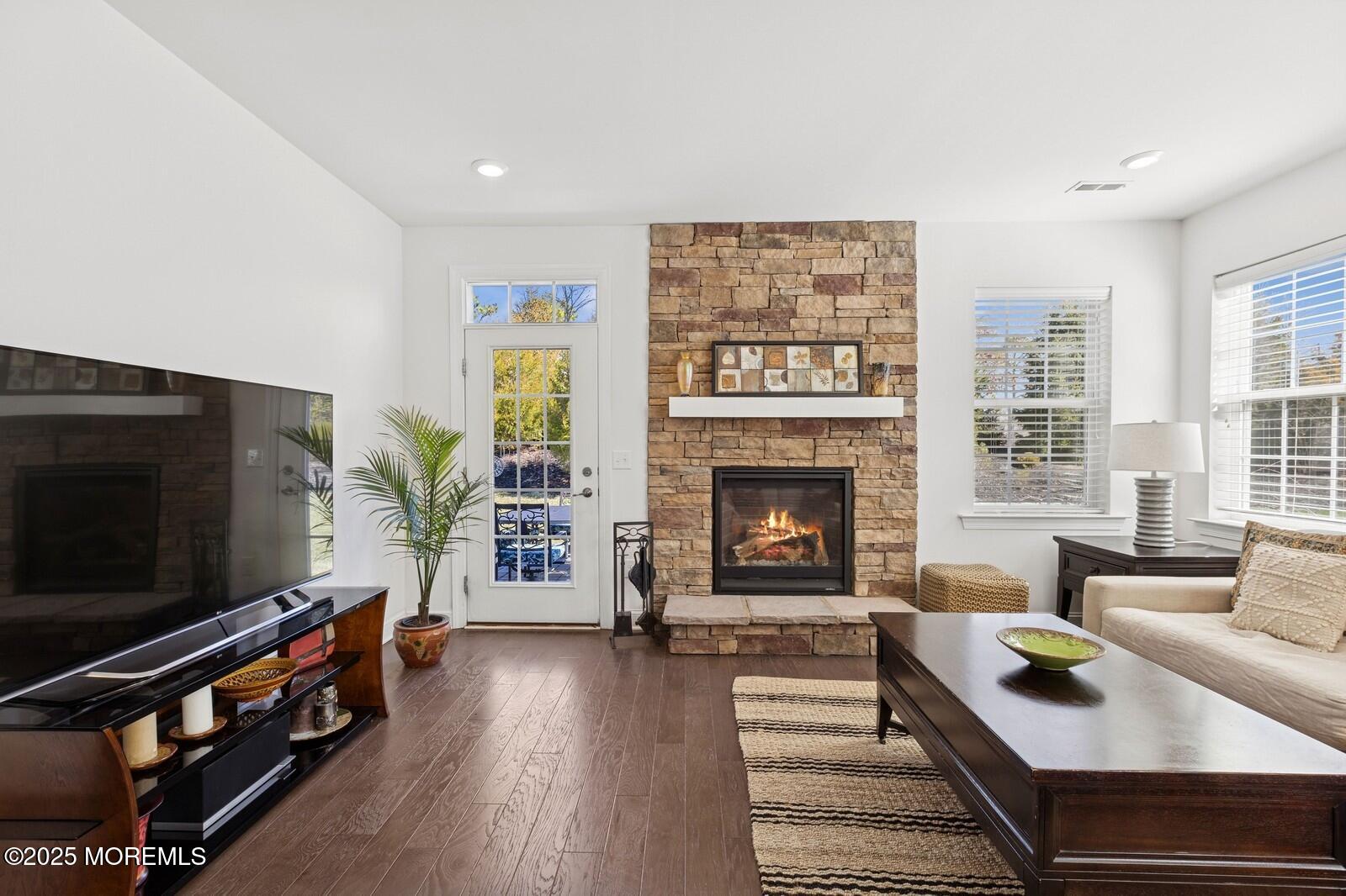 60 Butler Drive Barnegat, NJ 08005 - Photo 29 of 59 a living room with furniture and a fireplace or television