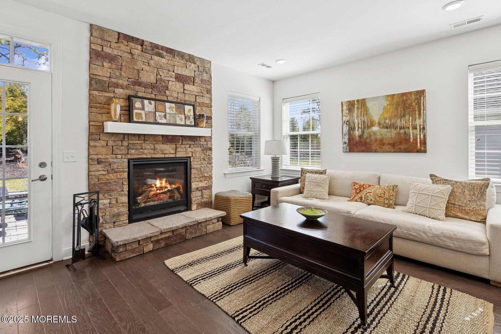 60 Butler Drive Barnegat, NJ 08005 - Photo 30 of 59 a living room with furniture and a fireplace