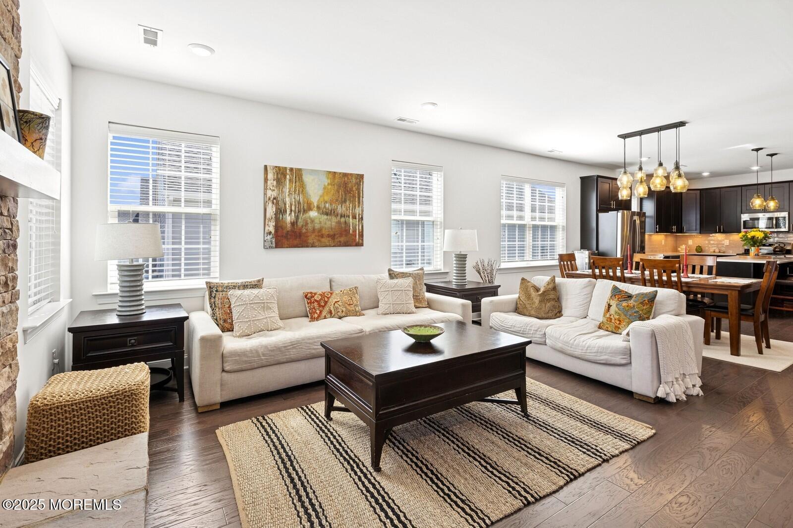 60 Butler Drive Barnegat, NJ 08005 - Photo 33 of 59 a living room with furniture and a fireplace