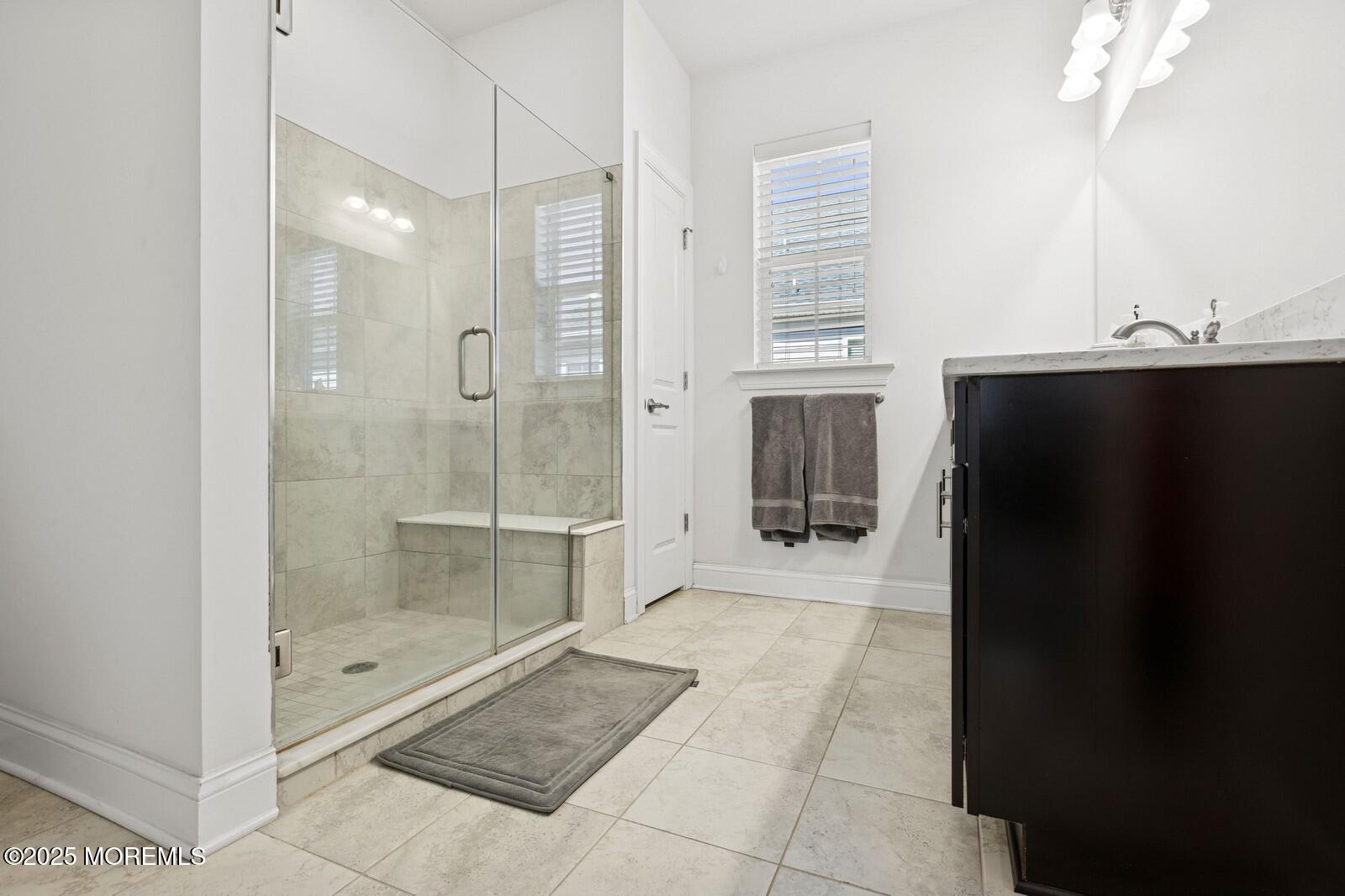 60 Butler Drive Barnegat, NJ 08005 - Photo 39 of 59 a bathroom with a glass shower door and a glass door