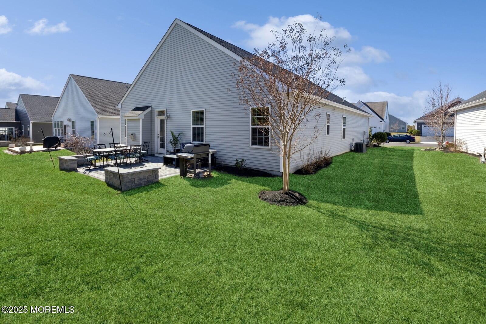 60 Butler Drive Barnegat, NJ 08005 - Photo 49 of 59 a backyard of a house with table and chairs