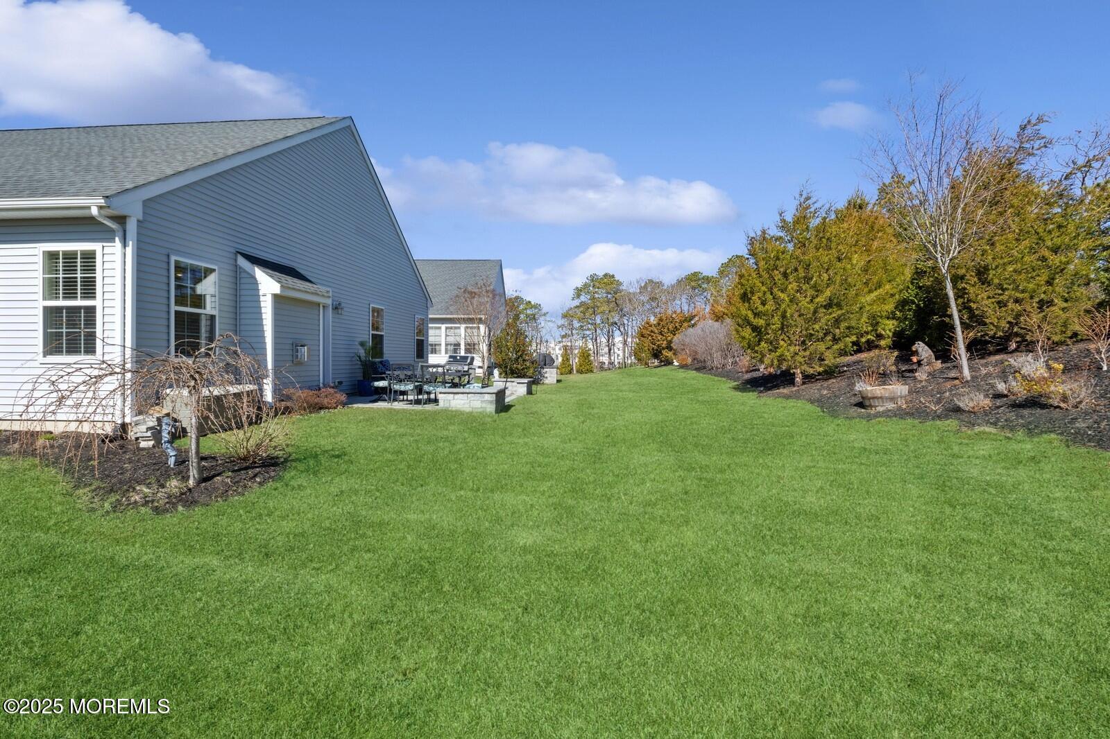 60 Butler Drive Barnegat, NJ 08005 - Photo 55 of 59 a view of a house with a backyard porch and sitting area