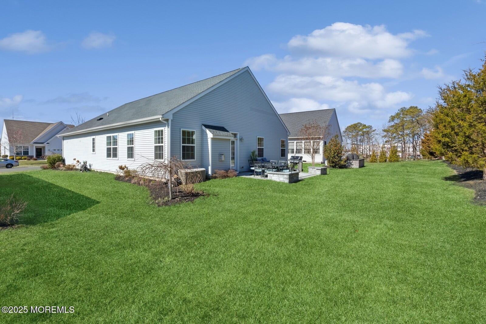 60 Butler Drive Barnegat, NJ 08005 - Photo 56 of 59 a view of a house with a big yard and sitting area