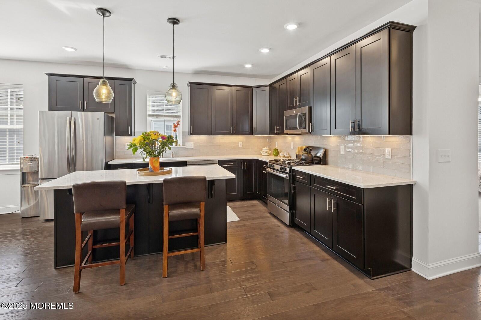 60 Butler Drive Barnegat, NJ 08005 - Photo 8 of 59 a kitchen with a sink cabinets and wooden floor