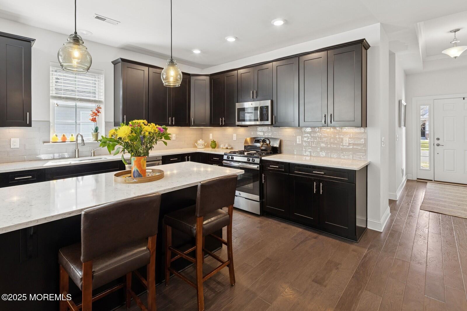 60 Butler Drive Barnegat, NJ 08005 - Photo 10 of 59 a kitchen with a sink and stove