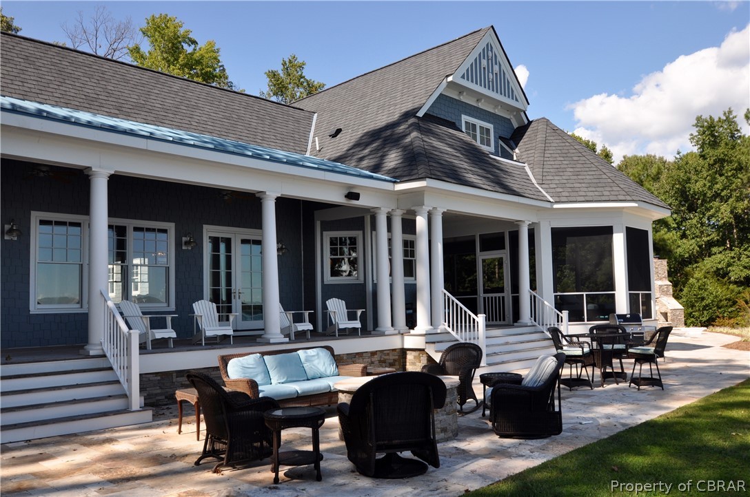 1000 Queenstown Road Lancaster, VA 22503 - Photo 13 of 49 a building outdoor space with patio furniture and potted plants