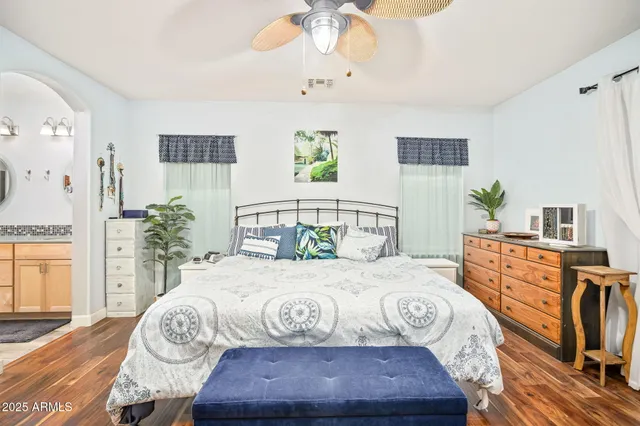 a bedroom with a bed dresser and a window