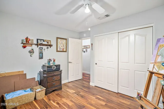 a view of room with furniture and wooden floor