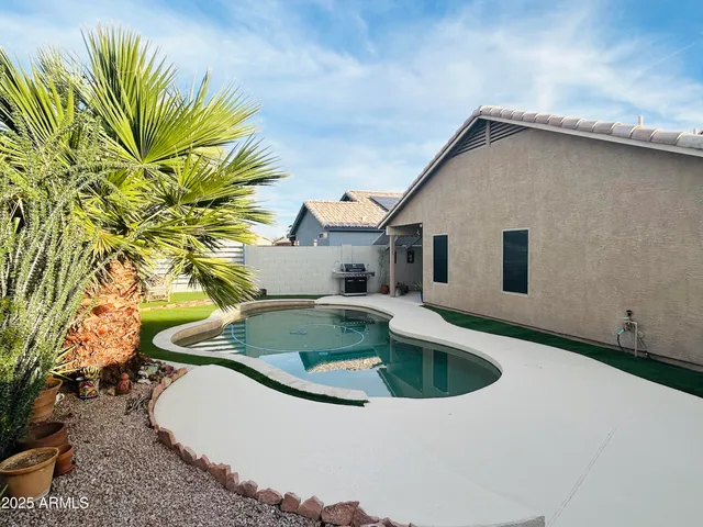 a house view with a swimming pool