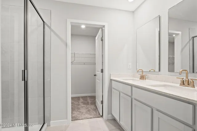 a bathroom with 2 sink and a mirror