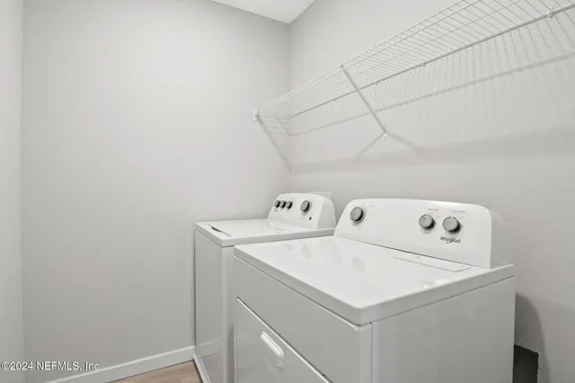 a utility room with dryer and washer