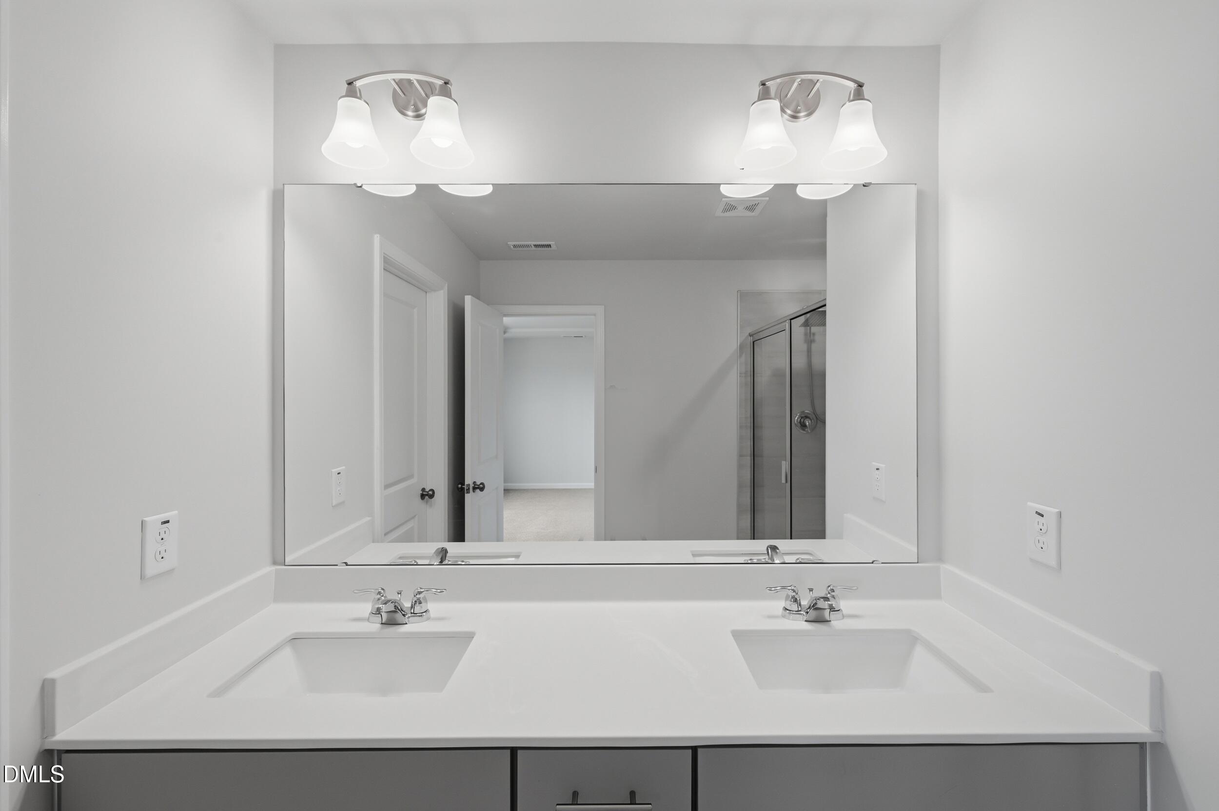 5011 Kota Street Raleigh, NC 27610 - Photo 34 of 42 a bathroom with a sink and a mirror