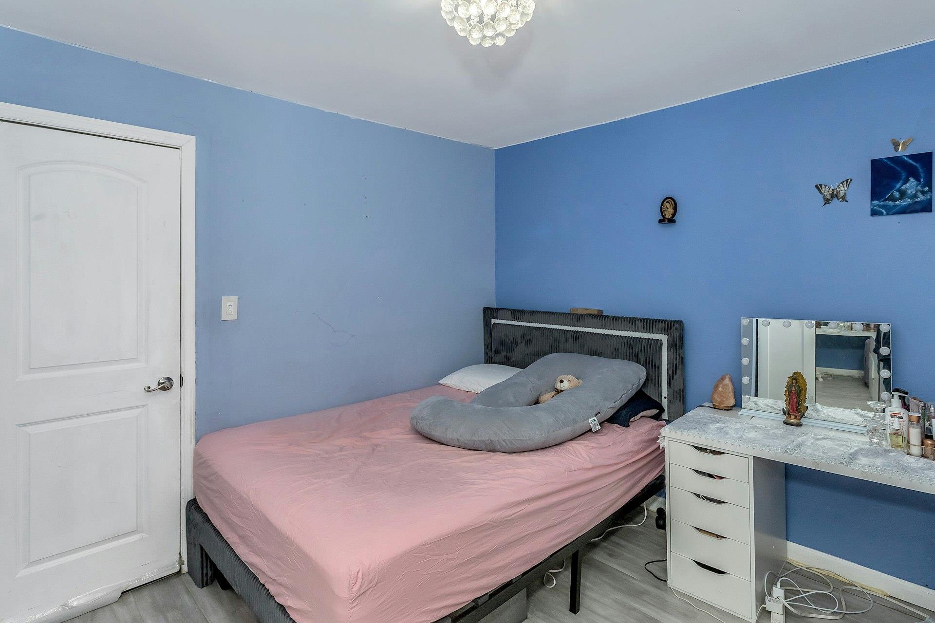 111-32 147th Street Queens, NY 11435 - Photo 13 of 24 Bedroom with light wood-style flooring