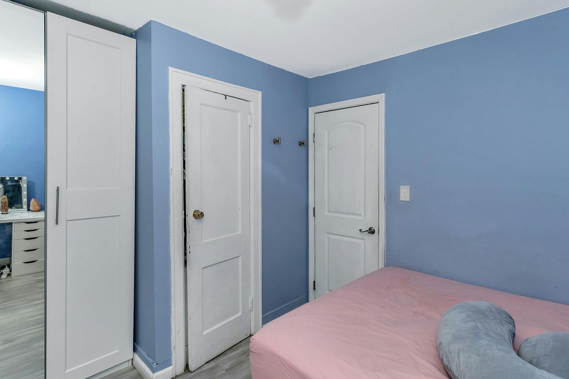 111-32 147th Street Queens, NY 11435 - Photo 15 of 24 Bedroom with light wood-style floors