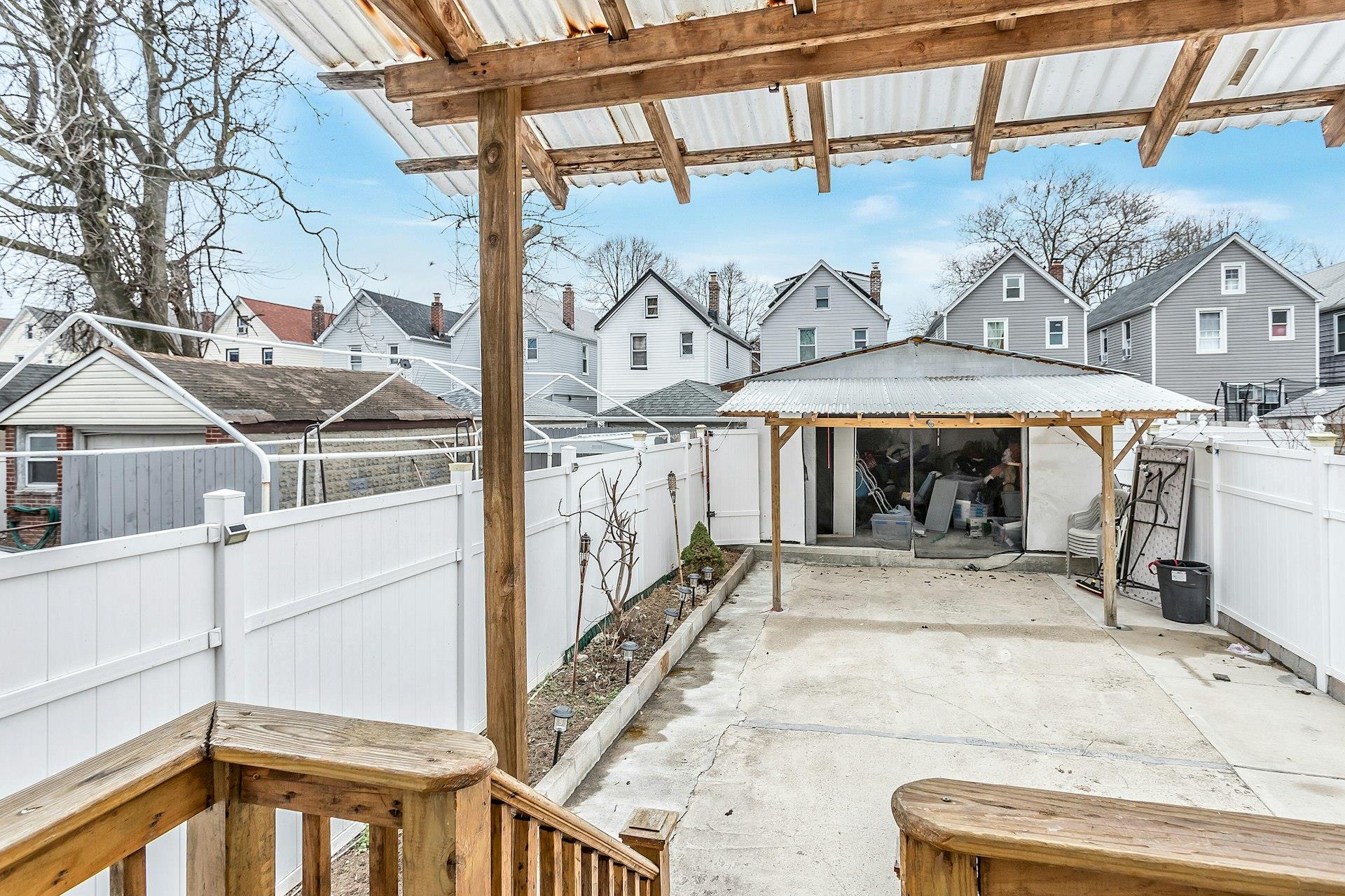 111-32 147th Street Queens, NY 11435 - Photo 20 of 24 View of patio / terrace with a gazebo, a fenced backyard, and a residential view