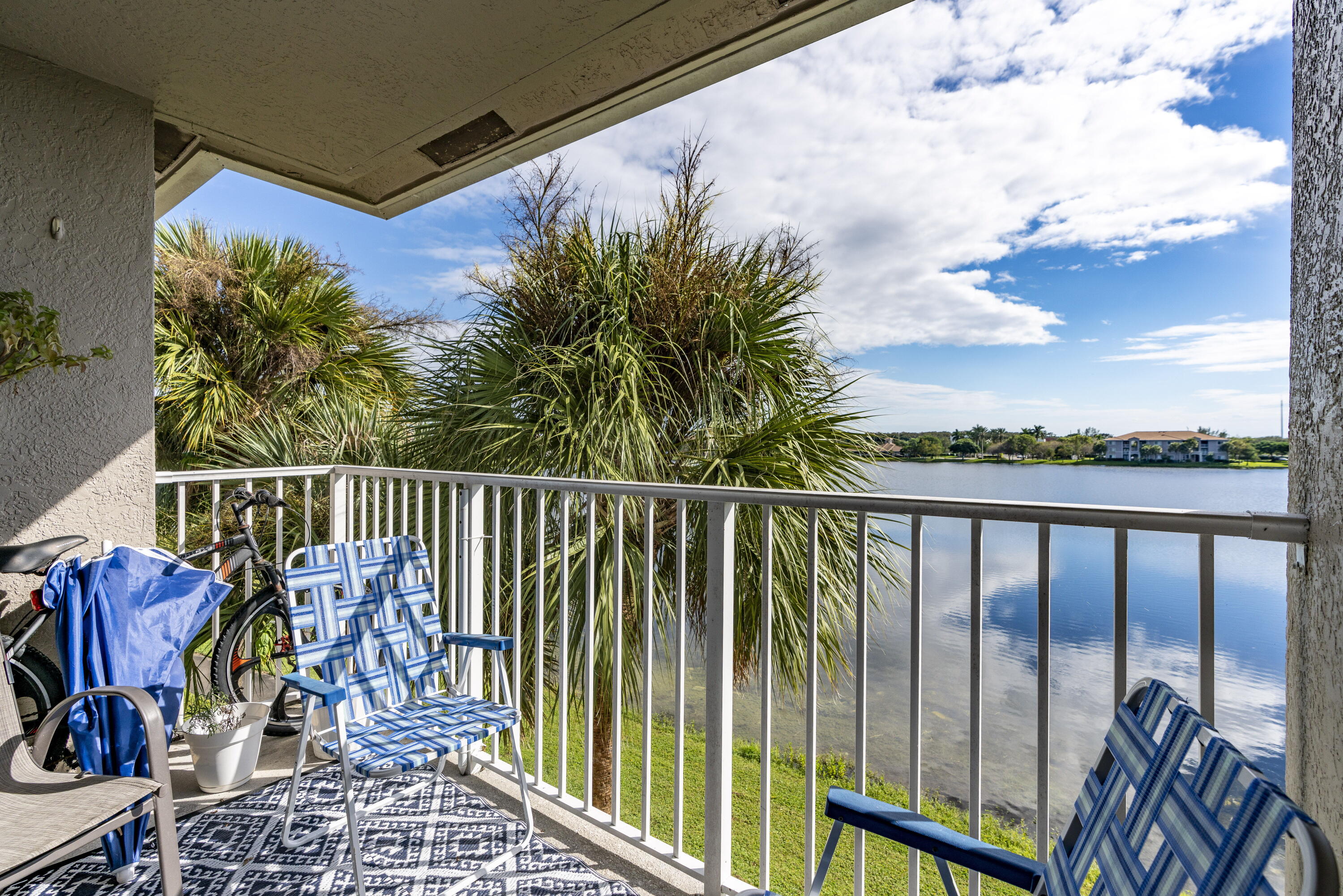 5031 Wiles Road, Unit 304 Coconut Creek, FL 33073 - Photo 18 of 55 a view of a balcony with furniture