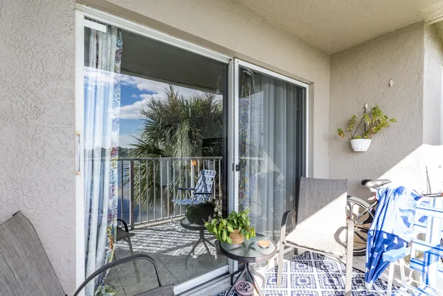a kitchen with kitchen island sink stove and cabinets