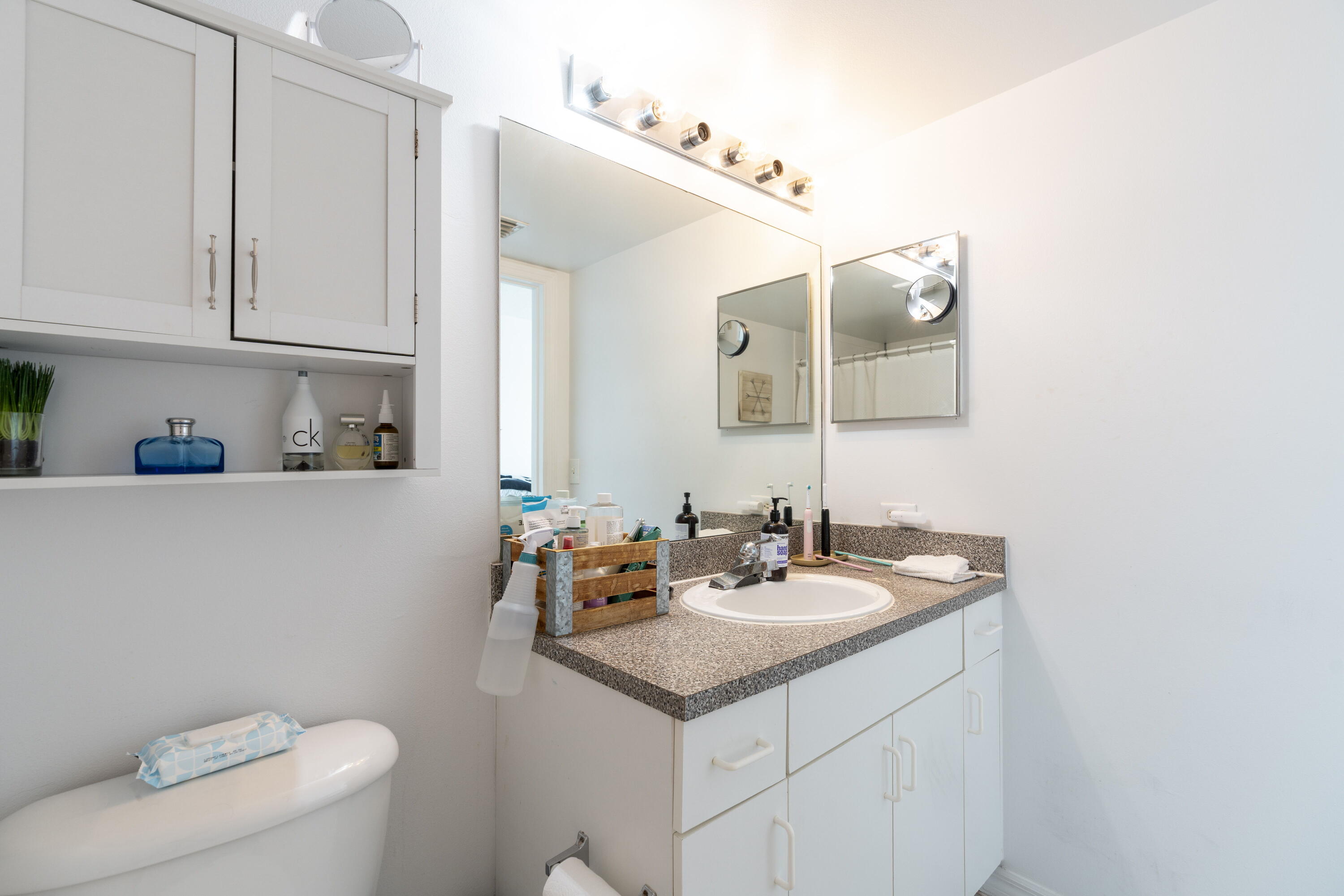 5031 Wiles Road, Unit 304 Coconut Creek, FL 33073 - Photo 38 of 55 a bathroom with a sink and a toilet