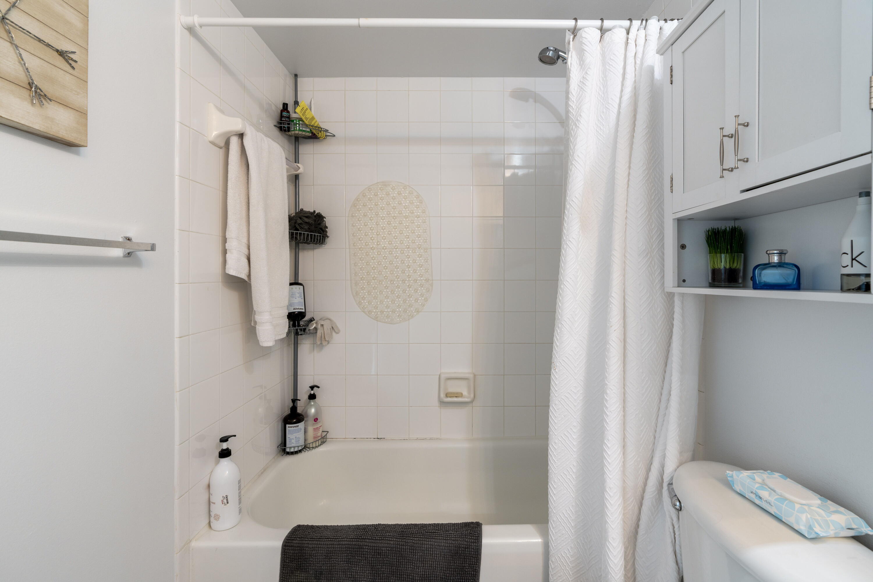 5031 Wiles Road, Unit 304 Coconut Creek, FL 33073 - Photo 39 of 55 a bathroom with a shower and a sink